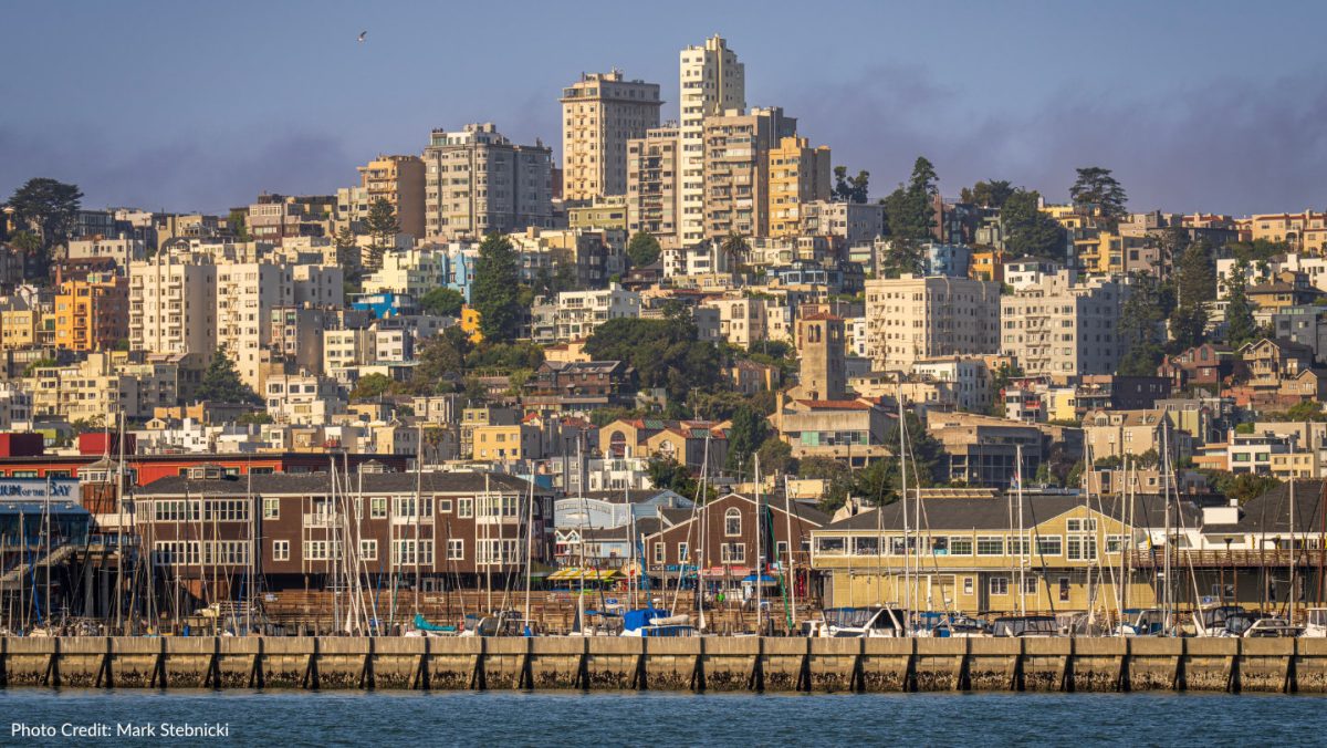 Scenic view of San Francisco Marina with iconic urban skyline backdrop.